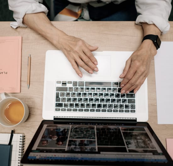 Marketing FAQ - Woman on a laptop